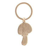 Gold keychain with a mushroom-shaped pendant on a white background