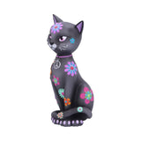 Black cat figurine with colorful floral designs on a white background