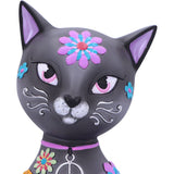 Decorative cat figurine with colorful floral designs on a white background