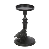 Black candle holder with bird design on a white background