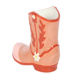 Pink ceramic boot with floral design on a white background