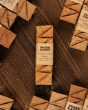 Tribe Earth incense sticks on a wooden surface