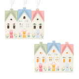 Set of two decorative house-shaped ornaments with pastel colors on a white background