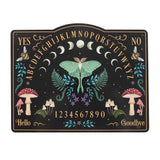 Decorative Ouija board with mystical design elements on a black background
