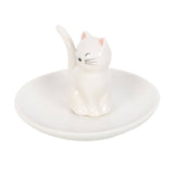 White ceramic ring dish with a cat design on a white background