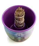 Purple sage bowl with a bundle of sage inside on a white background
