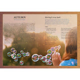 Woman blowing bubbles with a scenic autumn background and text overlay.