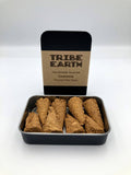 Tribe Earth handmade incense packaging with incense sticks in a tin on a white background