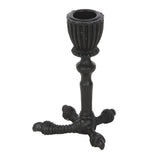 Black metal candle holder on a white background