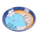 Decorative plate with moon and cloud design on a white background