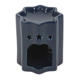 Navy blue ceramic oil burner with star designs on a white background