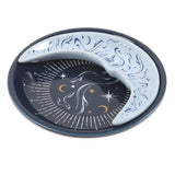 Two ceramic plates with celestial designs on a white background