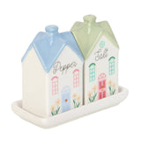 Ceramic salt and pepper shakers shaped like houses on a white background