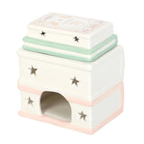 Small pet house with star designs on a white background