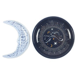 Decorative plates with celestial designs on a white background
