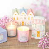 Candles with house designs and 'Wonderful Mum' text, surrounded by decorative houses and flowers.