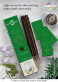 Incense sticks with packaging and crystals on a textured surface, featuring 'Sacred Elements' branding.