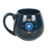 Black mug with celestial design on a white background
