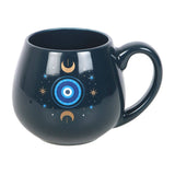 Black mug with celestial design on a white background