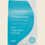 Package of Amazing Health Restored Magnesium Daily Bath Flakes on a beige background