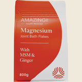 Package of Magnesium Joint Bath Flakes with MSM & Ginger on a beige background
