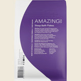 Purple package of 'Amazing Sleep Bath Flakes' with text on a white background