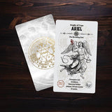 Card featuring an angel illustration and text on a wooden surface