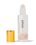 Aphrodite crystal-infused roller bottle with gold cap on a white background