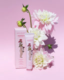 BOPC Women's Aphrodesite hand cream with packaging on a pink background with flowers.