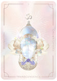 Crystal pendant with floral design on a pastel card, featuring the word 'Transcendence'.