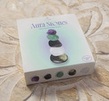 Box of Aura Stones on a wooden surface