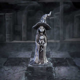 Statue of a witch with a black hat and long hair in a dark, mystical setting.