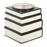 Decorative candle holder with black and white design on a white background