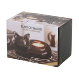Box packaging of a ceramic tealight holder shaped like a black cat with 'Black Cat Magick' text.
