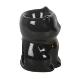 Black ceramic cat-shaped oil burner on a white background