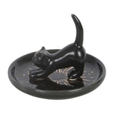 Black cat figurine on a round tray with a white background