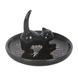 Black ceramic dish with a cat design on a white background