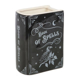 Decorative container with 'Book of Spells' design on a white background