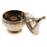 Brass incense burner with lid on a white background