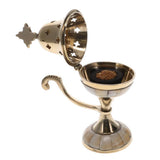 Decorative brass incense burner with star design on a white background