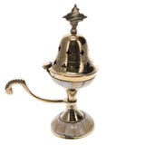 Gold-colored incense burner with decorative elements on a white background