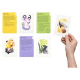 Hand holding a card among other cards with illustrations and text on a white background