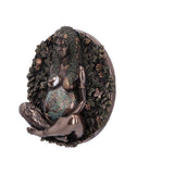 Decorative wall piece with a woman figure surrounded by foliage and flowers on a white background