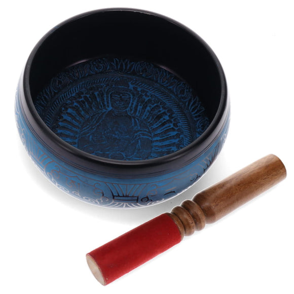 Blue singing bowl with a wooden stick on a white background