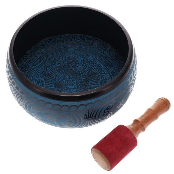 Blue singing bowl with a wooden mallet on a white background