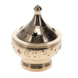 Decorative brass incense burner with star and moon designs on a white background