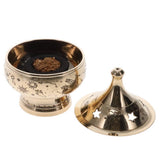 Gold incense burner with star and moon designs on a white background