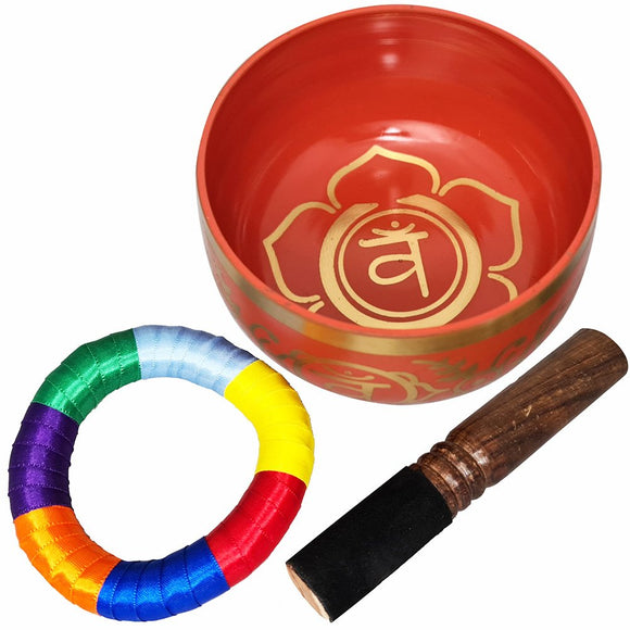 Red singing bowl with gold design, rainbow-colored mallet, and wooden stick on a white background