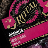 Close-up of a 'Ritual Bombita' chocolate packaging with pink and black design.