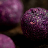 Close-up of purple bath bombs with a blurred background